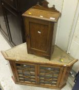 A small oak cupboard with single panelled door opening to reveal single shelf and a 19th Century