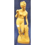 An early 20th Century Copenhagen terracotta figure of a nude standing beside a treestump with apple