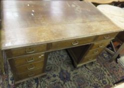 A mid 20th Century oak pedestal desk,