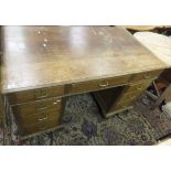 A mid 20th Century oak pedestal desk,