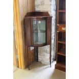 An Edwardian mahogany and inlaid and transfer decorated corner cupboard,