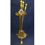 A brass oil lamp, fireside companion set, three pairs of brass candlesticks,