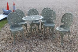 A painted cast metal set of six garden chairs and a circular table CONDITION REPORTS