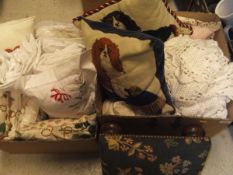 Three boxes of assorted textiles to include cotton bedding, scatter cushions, crochet throw, etc,