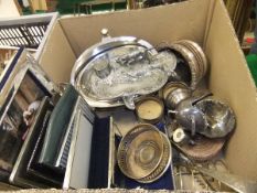 A box of assorted plated wares to include various modern photograph frames, wine coasters,