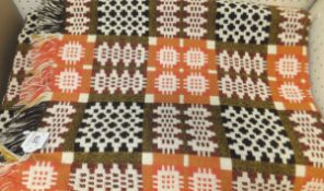 A Welsh blanket in brown, cream,