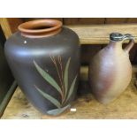 A collection of studio pottery wares to include large vase decorated with foliage on a brown ground,