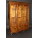 An Edwardian mahogany and satinwood strung three section bookcase,