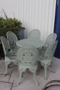 A painted cast metal set of six garden chairs and a circular table CONDITION REPORTS