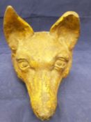 A Victorian painted iron fox mask doorstop and another doorstop as a kilted Scotsman with lance