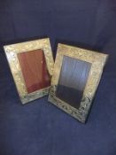 A pair of modern silver photograph frames with scrolling foliate decoration in the Art Nouveau