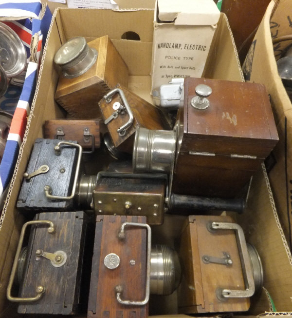 A collection of various mainly wooden cased lamps including Exide, GEC,