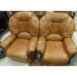 A pair of modern light tan / brown armchairs