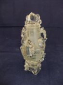 A Chinese clear cut rock crystal dressing table bottle of slab cut baluster form with ring handles