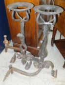 A pair of circa 1900 wrought iron andirons with integral ale mullers,