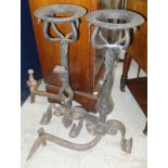 A pair of circa 1900 wrought iron andirons with integral ale mullers,