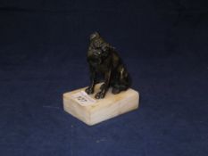 A Modernist style bronze figure of a boxer dog seated, signed "Dengg",