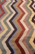 A Kelim style rug with zig-zag pattern in oatmeal, barley, taupe, cherry red,