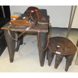 A Nupe carved hardwood stool, the rectangular top on four tapered legs united by stretchers,