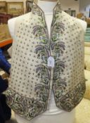 An early 19th Century gentleman's waistcoat, the cream ground with green,