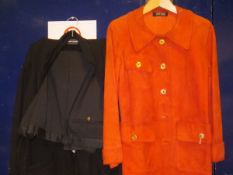 A circa 1970 Jean Muir orange suede coat, together with a pair of Yves Saint Laurent black trousers,