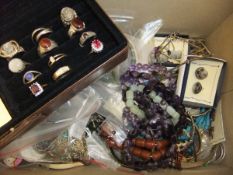 A box of assorted costume jewellery to include assorted necklaces, bracelets,