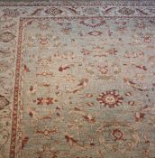 A Zeigler rug, the all-over foliate and floral decoration in olive green,