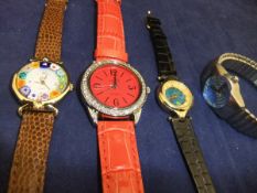 A collection of four various fashion watches, to include an Orvis quartz watch,