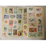 A box containing "The Pelham Junior Stamp Album" containing various UK and World postage stamps,
