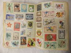 A box containing "The Pelham Junior Stamp Album" containing various UK and World postage stamps,