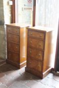 A pair of slim flame mahogany and crossbanded chests of four drawers in the 19th Century style,