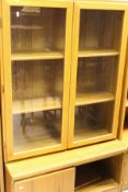 Two teak two-door cupboards with open shelf over, and two teak lounge units,