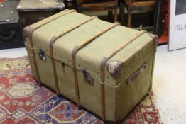 A green canvas and wooden bound steamer trunk CONDITION REPORTS Overall with wear,