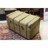 A green canvas and wooden bound steamer trunk CONDITION REPORTS Overall with wear,