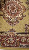 A Caucasian rug with central lozenge in reds, creams and black on a mustard ground,