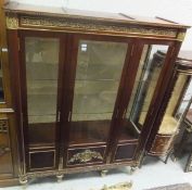 A reproduction mahogany and brass mounted display cabinet in the Louis XV manner,