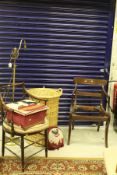 A brass down lighter, a wicker laundry basket, a mahogany framed carver chair with circular seat,