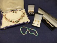 A collection of various pearl jewellery to include a seed pearl ruby and emerald necklace,