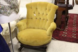 A Victorian rocking tub armchair with buttoned back,
