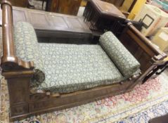 A 19th Century mahogany lit en bateau daybed with pale blue and cream floral upholstery