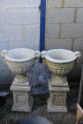 A pair of composite stone plant pots in the Greco Roman taste,