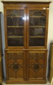 A Victorian Gothic Revival oak bookcase cabinet,