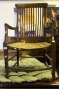 A beech and elm framed carver chair with rush seat,