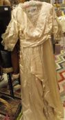 A circa 1900 cream silk wedding dress