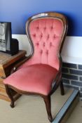 A Victorian style spoon back chair with peach coloured upholstery