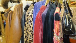 A collection of vintage clothing, to include leather and sheepskin lined coats,