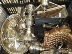 A box of assorted plated wares to include a pair of three branch candelabra, sauceboat, cutlery,