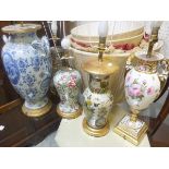 A Continental porcelain twin-handled urn decorated with peonies and butterflies (mounted as a table