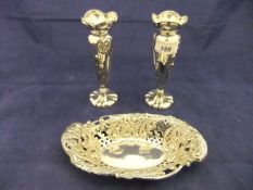 A pair of embossed floral decorated silver bud vases (by Henry Williamson Ltd of Birmingham 1905),