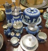 A collection of Wedgwood blue Jasper ware to include stilton dome and stand, biscuit barrel,